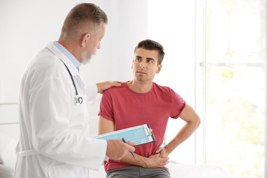 Man speaking with doctor about men's health and prostate cancer screening